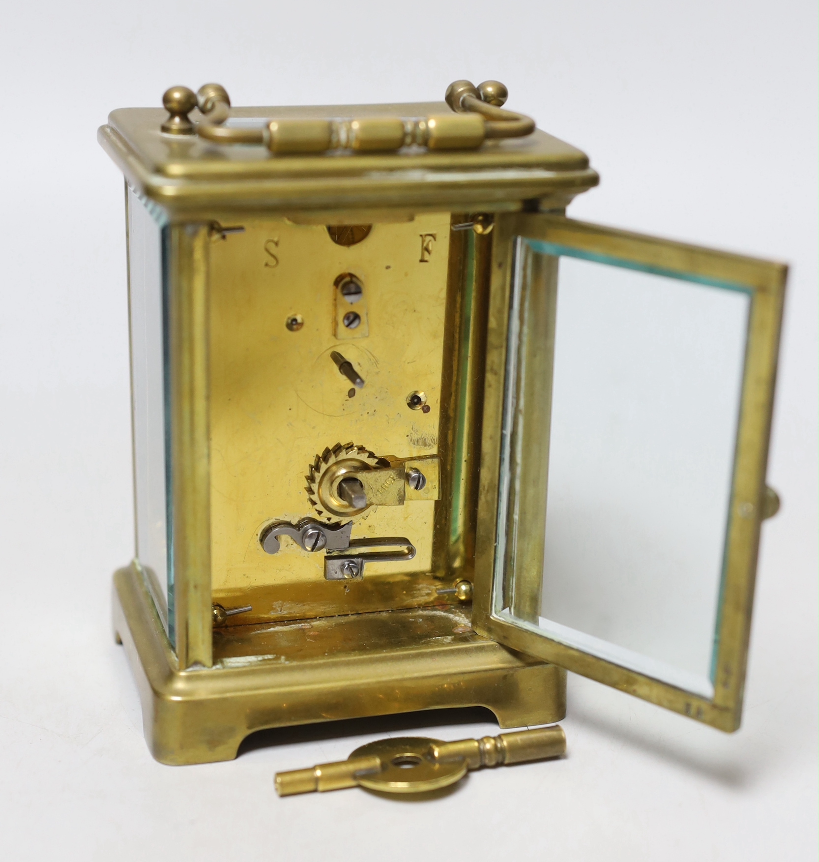 A brass carriage clock, 11cm high